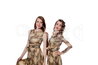 Pretty models posing in dresses from same cloth