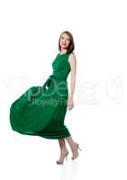 Beautiful brunette posing in trendy green dress