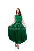 Happy young woman posing in bright green dress
