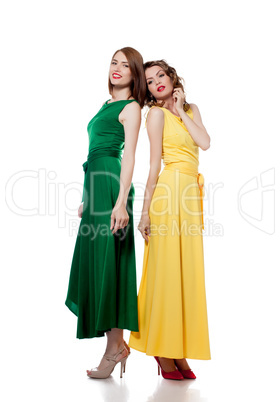 Beautiful young models posing in colorful dresses