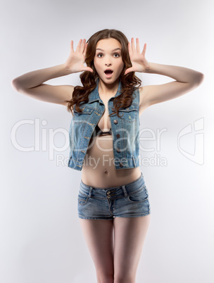 Image of surprised beautiful girl posing in studio