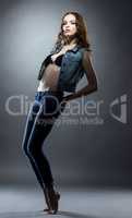 Beautiful jeanswear model posing at camera