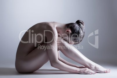 Nude model posing at camera. Concept of inner calm