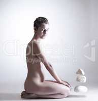 Pretty nude woman with silver skin and stones