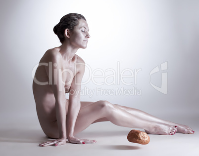 Woman moving stone without touching it