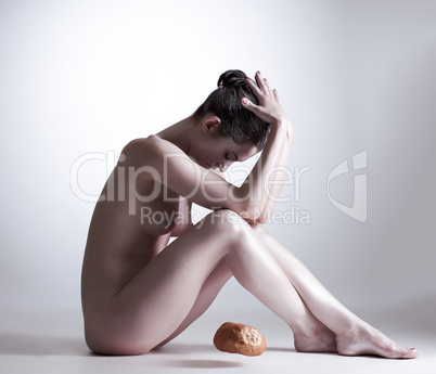 Image of focused girl telekinetically moving stone