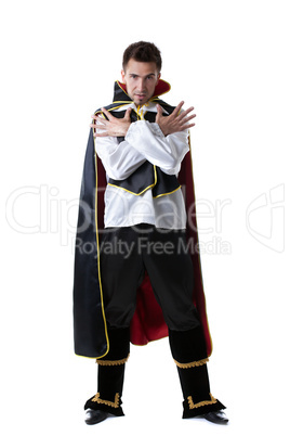 Pretentious man posing in costume of illusionist
