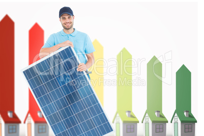 Composite image of smiling construction worker holding solar pan