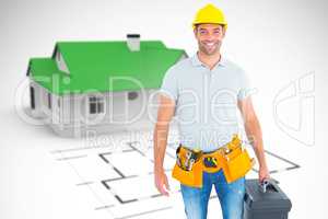 Composite image of portrait of smiling handyman holding toolbox