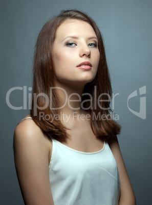 Portrait of cute young brunette with healthy skin