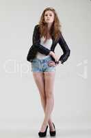 Studio shot of young model posing in casual outfit