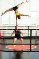 Strong man doing acrobatic rack with his partner