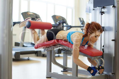 Image of female athlete exercising on bench