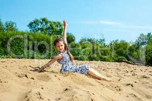 Cute little girl resting on beach
