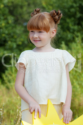 Image of lovely red-haired girl posing in park