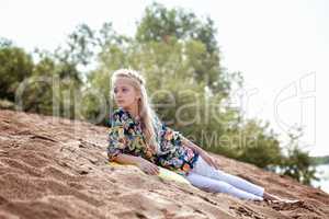 Image of pretty young girl on vacation in park