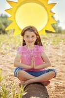 Image of adorable little girl in lotus position