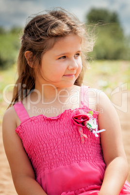 Portrait of lovely brown-eyed girl resting in park