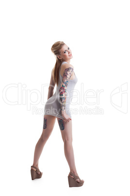 Smiling young model with tattoos