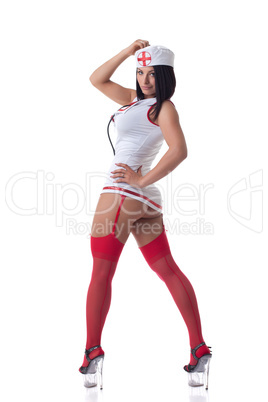 Busty nurse posing in erotic suit and stockings