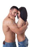 Muscular man hugging his topless girlfriend