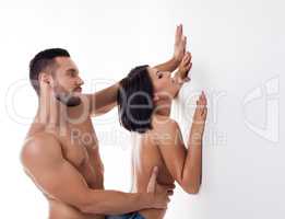 Excited young couple having sex standing