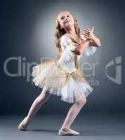 Studio shot of graceful little ballet dancer