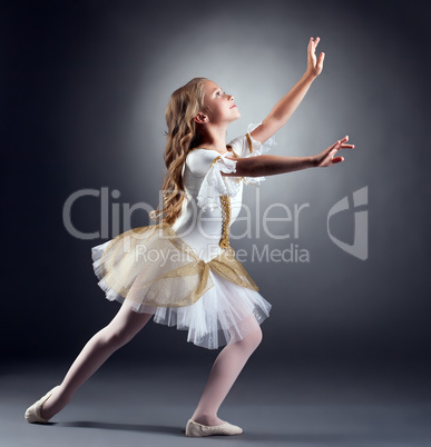 Lovely little ballerina dancing at camera