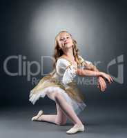 Image of nice little ballerina posing at camera