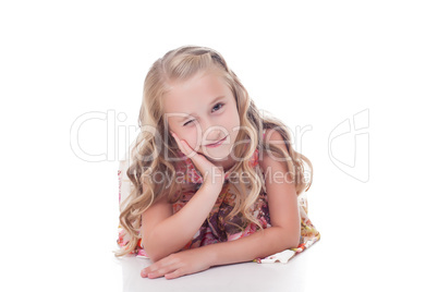 Portrait of adorable blonde girl winks at camera