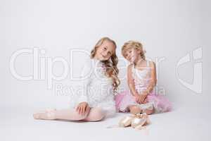 Lovely little ballerinas posing in studio