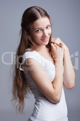 Cute smiling girl posing at camera, close-up