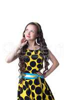 Portrait of dreamy freckled girl posing in dress