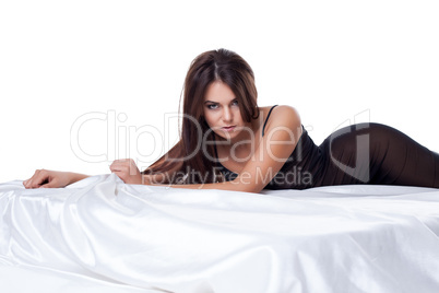 Brown-eyed model in negligee posing at camera