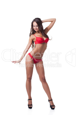 Charming slim woman posing in red underwear