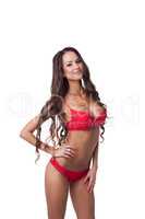 Gorgeous slim model dressed in red erotic lingerie