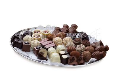 Dish with lot of tasty chocolate candies