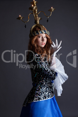 Beautiful dancer with candelabra on her head