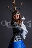 Beautiful dancer with candelabra on her head