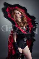 Redhead girl posing in fashionable spider costume