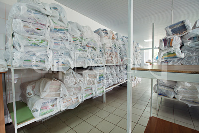 Shelves with clean linen in dry cleaning
