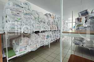 Shelves with clean linen in dry cleaning