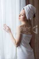 Portrait of sensual woman posing after shower