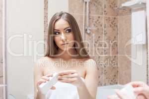 Portrait of attractive young woman in bathroom