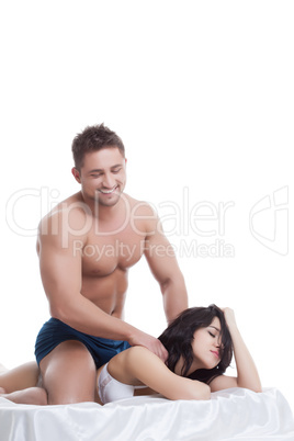 Smiling man doing massage to his mistress