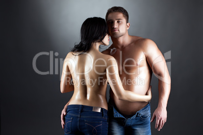 Image of topless lovers embracing at camera