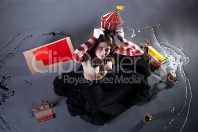 Top view of pretty circus performer posing topless