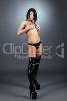 Stripper dressed in panties and leather boots