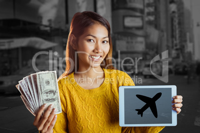 Composite image of smiling asian woman showing tablet and bank n