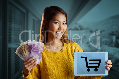 Composite image of smiling asian woman showing tablet and bank n